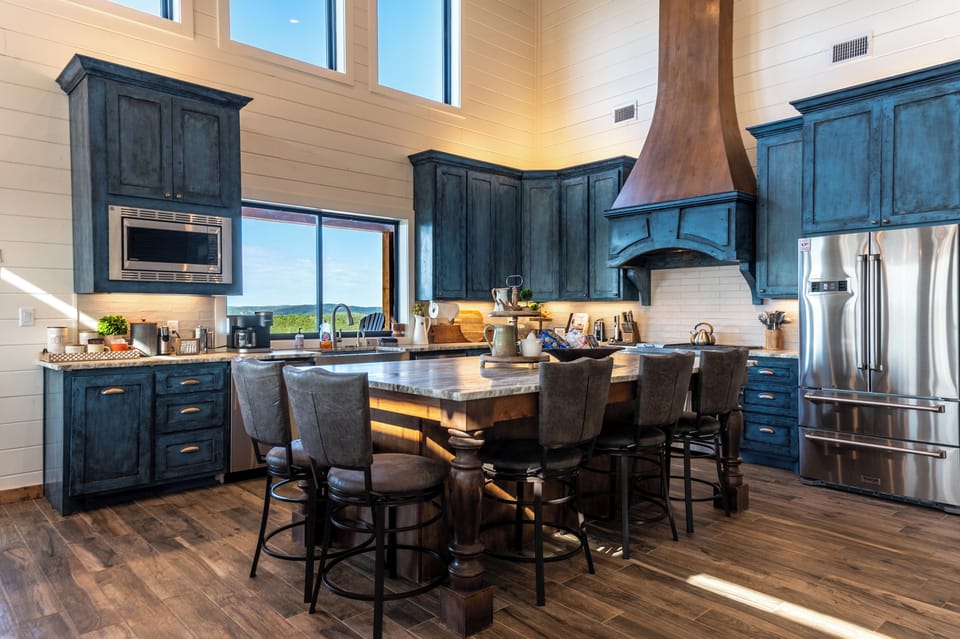 Modern rustic kitchen with island and copper range hood