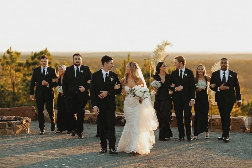 Joyful wedding party at Restoration Point, Broken Bow, OK.