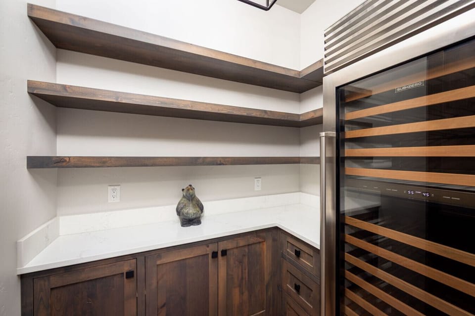 The pantry located just off the kitchen has enough space for the entire Costco trip.  There`s also a wine fridge!