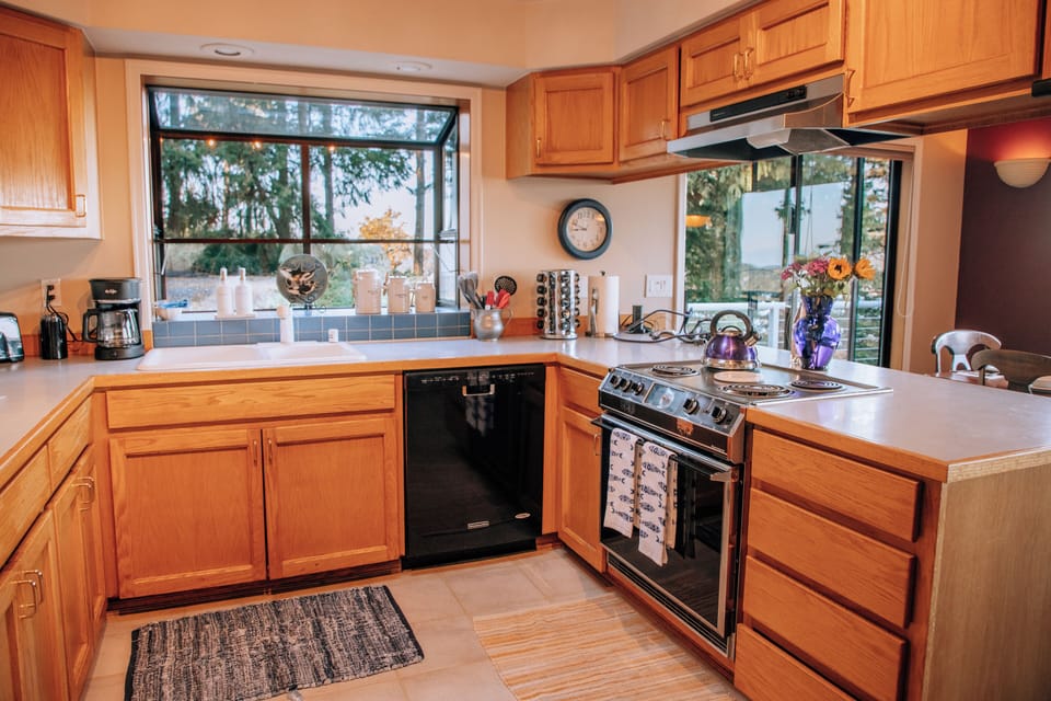 Spacious full kitchen stocked with cookware, dishes, and essentials.