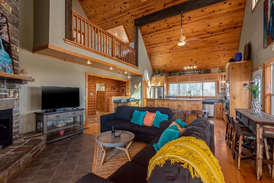 Soaring ceilings, leather sofas and rustic décor create a warm gathering space for movie nights or board games.