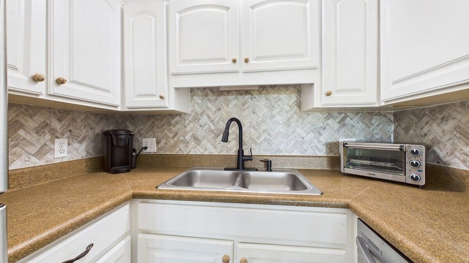 Full kitchen with stainless appliances and all the cooking essentials