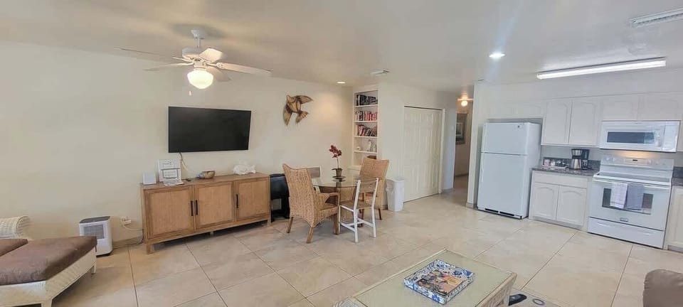 Inviting lounge and kitchen area with warm décor, ample seating, and everything guests need for effortless meals, movie nights, and downtime.