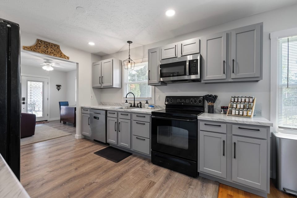 Stove, microwave, spices and oven for cooking