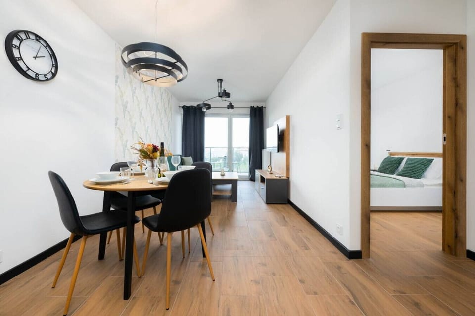 Open Dining and Living Area with Direct Access to Bedroom and Balcony View | Book Now with RENTUJEMY.COM