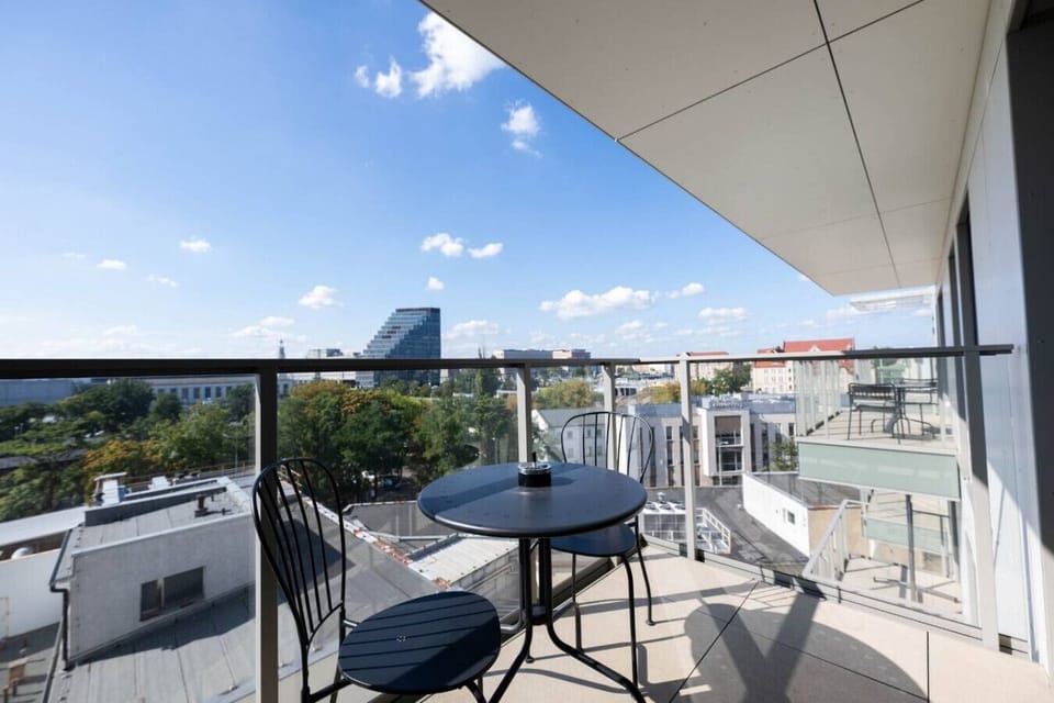Private Balcony with Outdoor Seating and Stunning City Views | Book Now with RENTUJEMY.COM