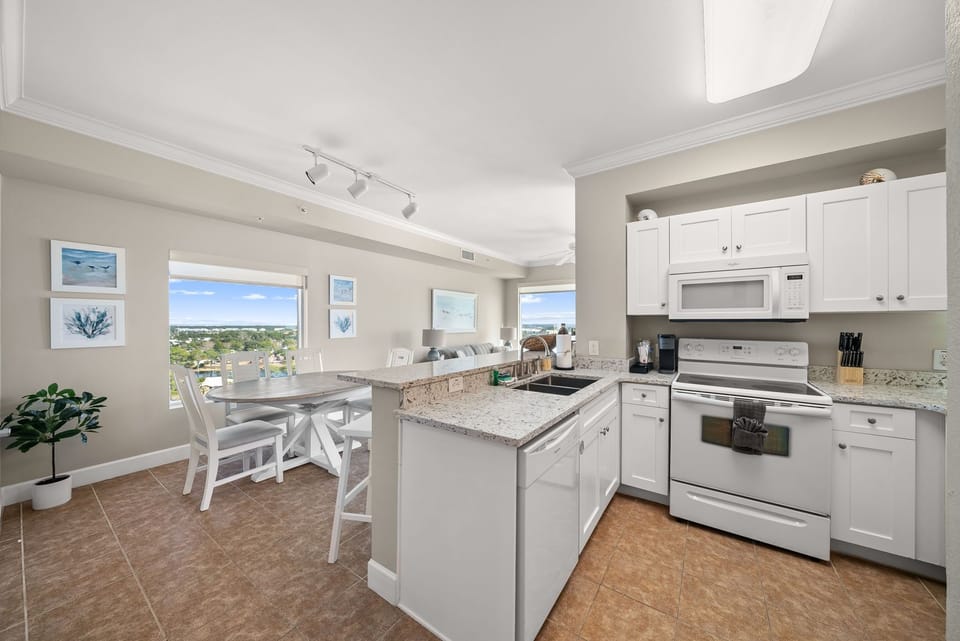 Bright kitchen with Keurig and dining views of Panama City Beach