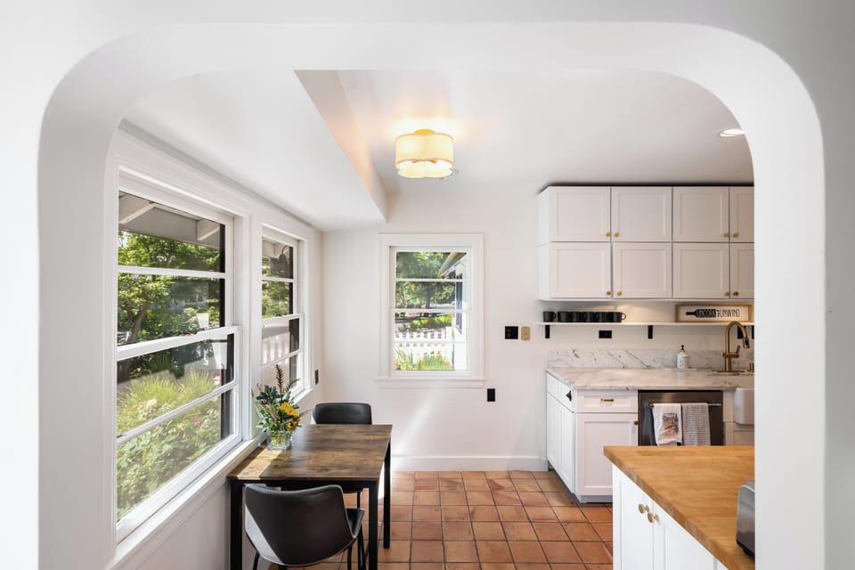 Ample storage space and a cozy eat-in table for meals or work.