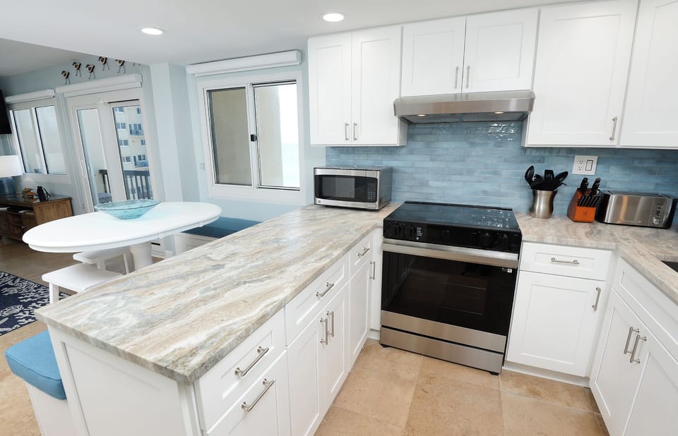 Kitchen with granite countertops and glass top convection oven