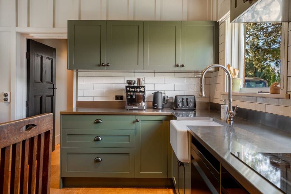 Fully equipped kitchen blending heritage design and modern function - enjoy a relaxed breakfast before your Central Otago adventures.