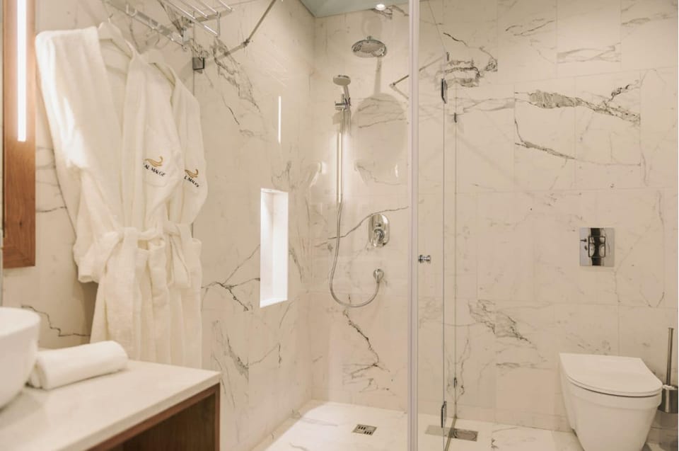 Family Suite, Balcony, City View | Bathroom | Shower, free toiletries, hair dryer, slippers