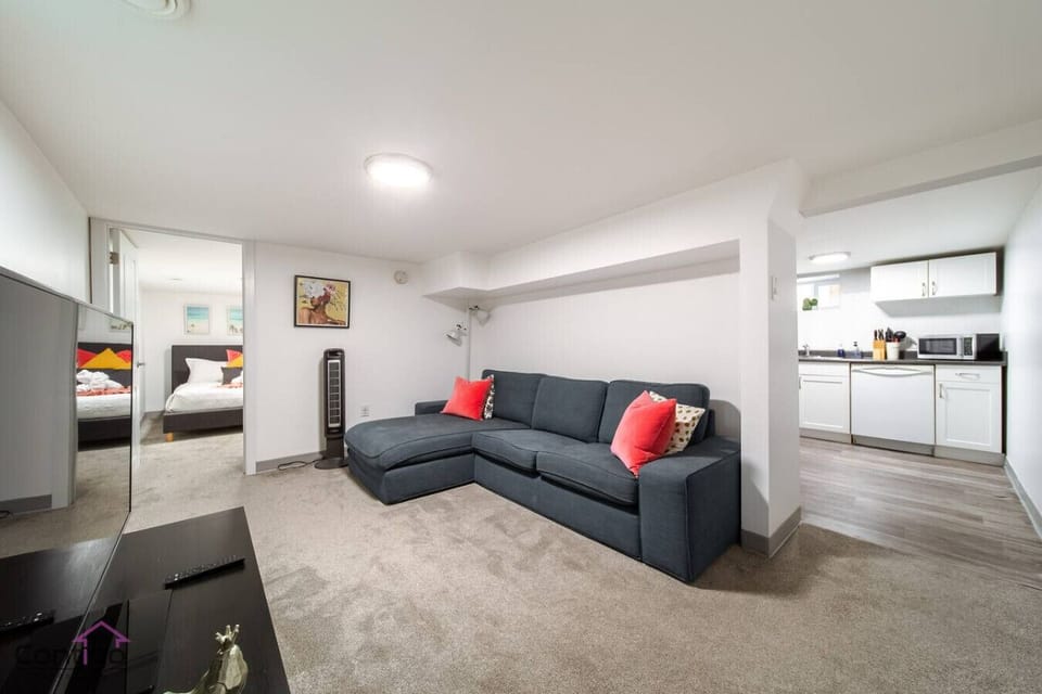 The lounge is perfect for downtime with a sofa to sink into and a smart TV to keep you entertained. A cozy hub of the suite.