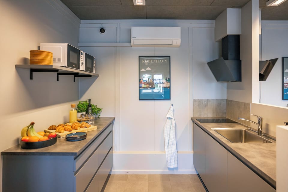 Shared fridge, microwave, cleaning supplies, paper towels