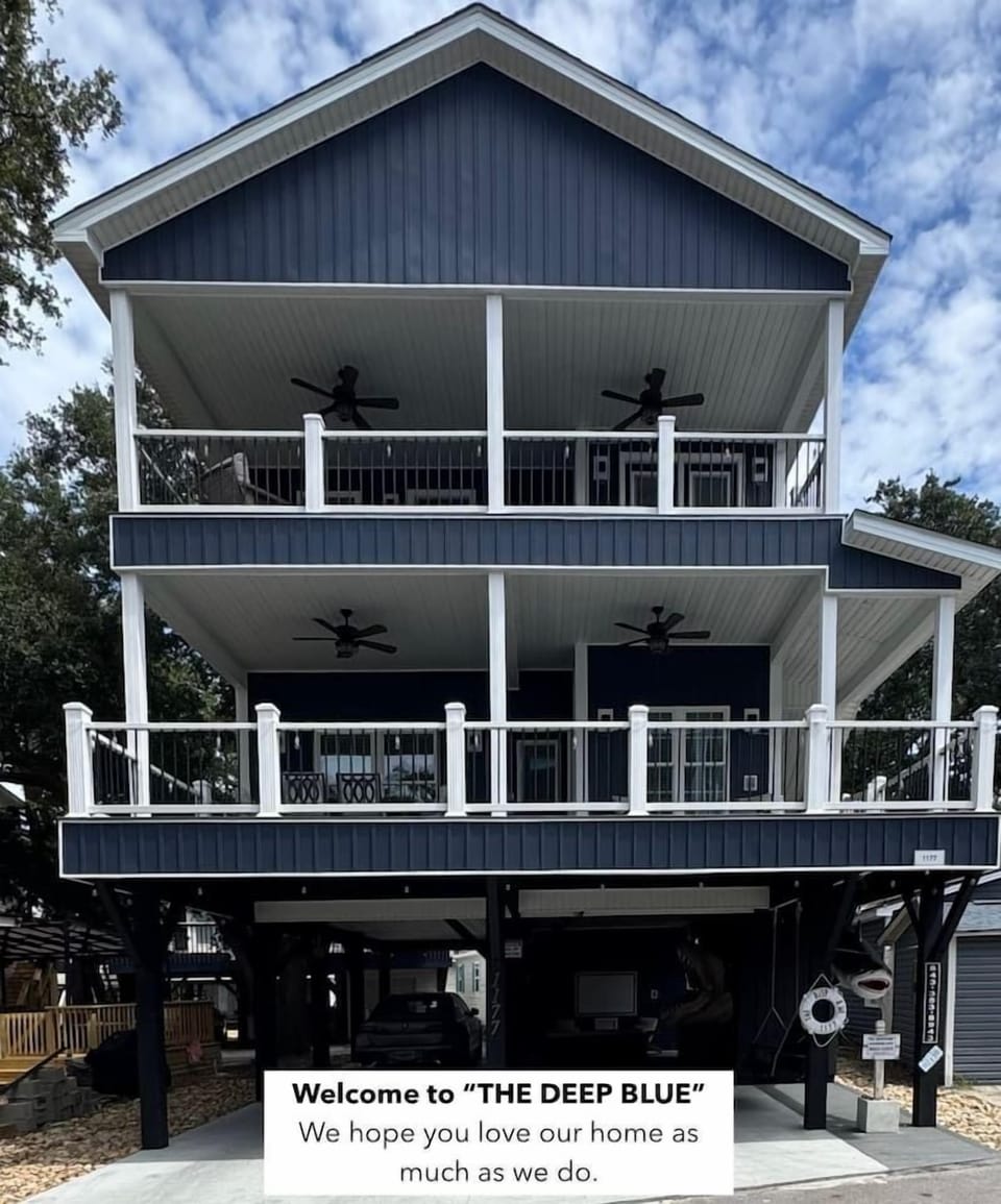 Front view of The Deep Blue, a luxury 5-bedroom beach house in Ocean Lakes — just 200 steps from the sand.