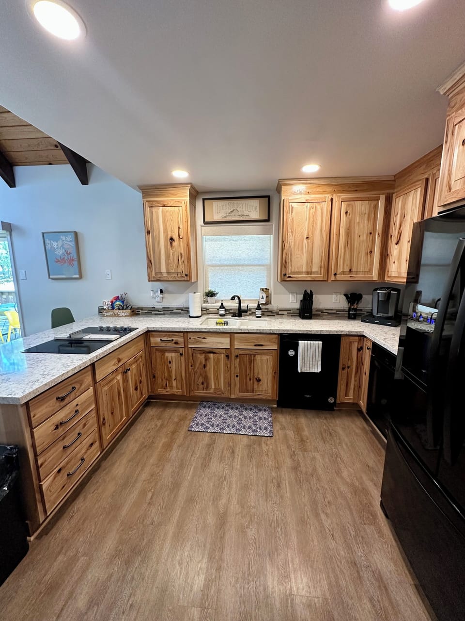 Kitchen with granite countertops and knotty pine cabinets