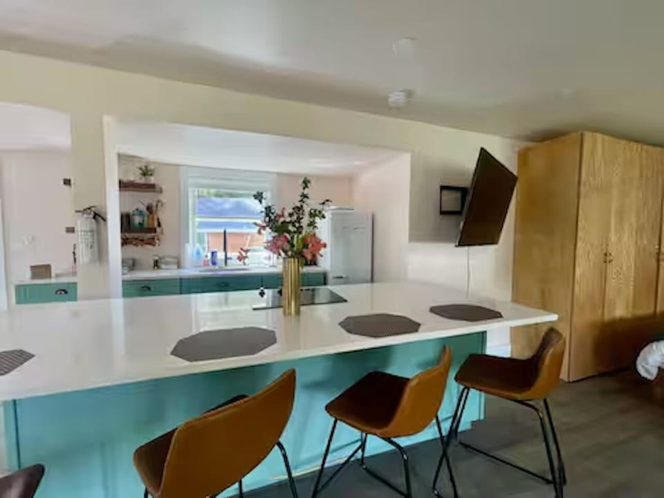 Sleek island for breakfast, wine, and warm conversation—seats four.
