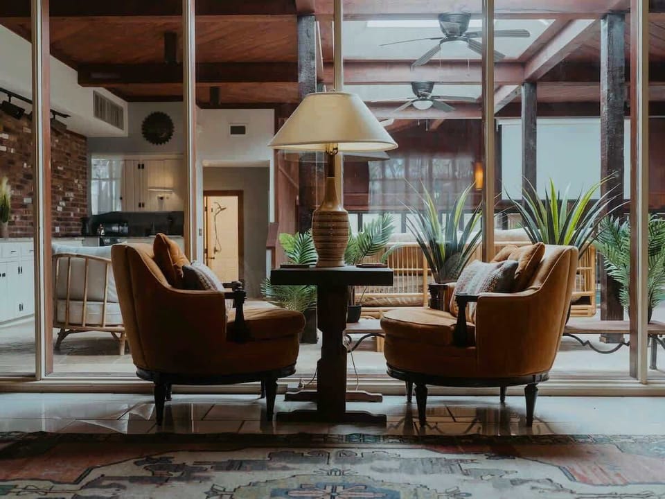 The best view of both worlds… indoor AC, TV, view of pool and spa deck and perhaps cards with a friend. 