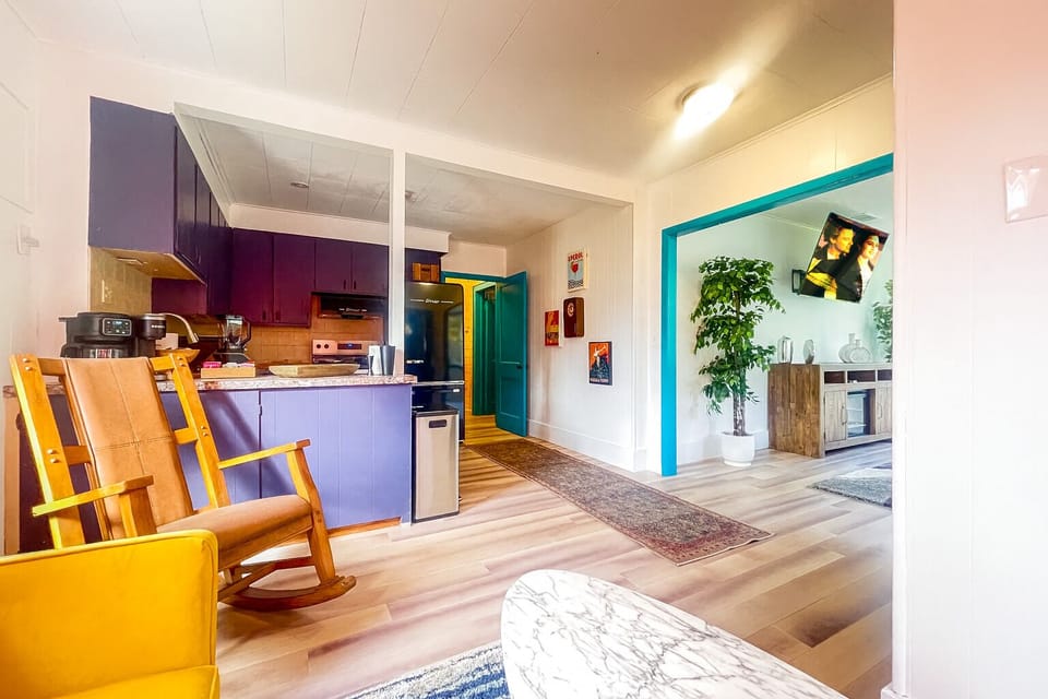 Bright open-concept living with color, charm & modern touches.