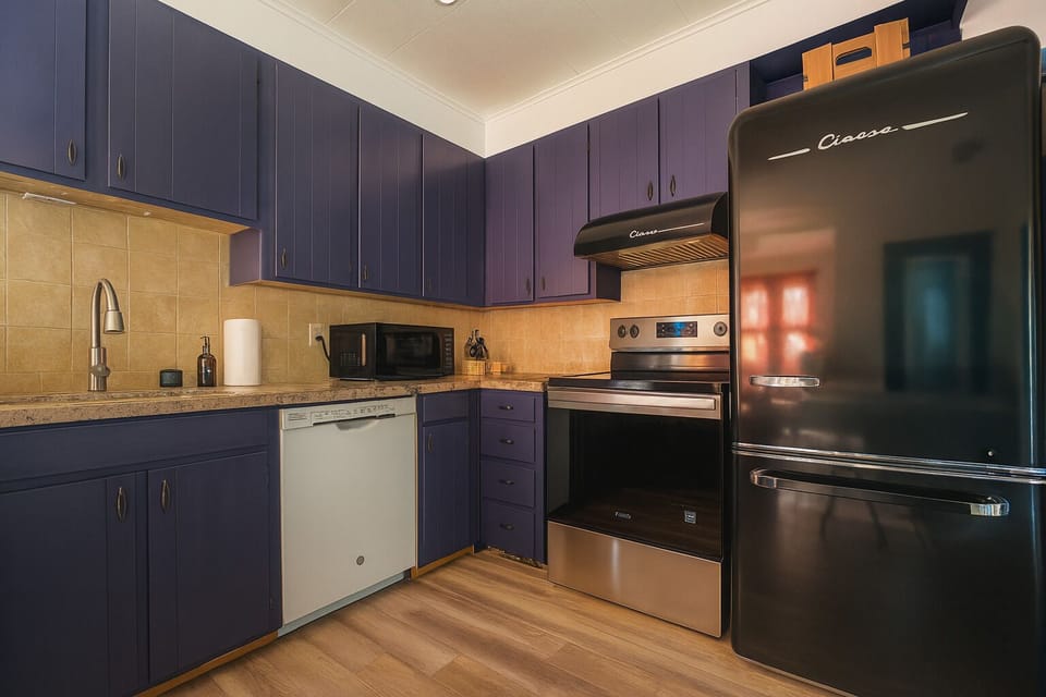 Bold kitchen with modern tools—perfect for cooking and making memories.