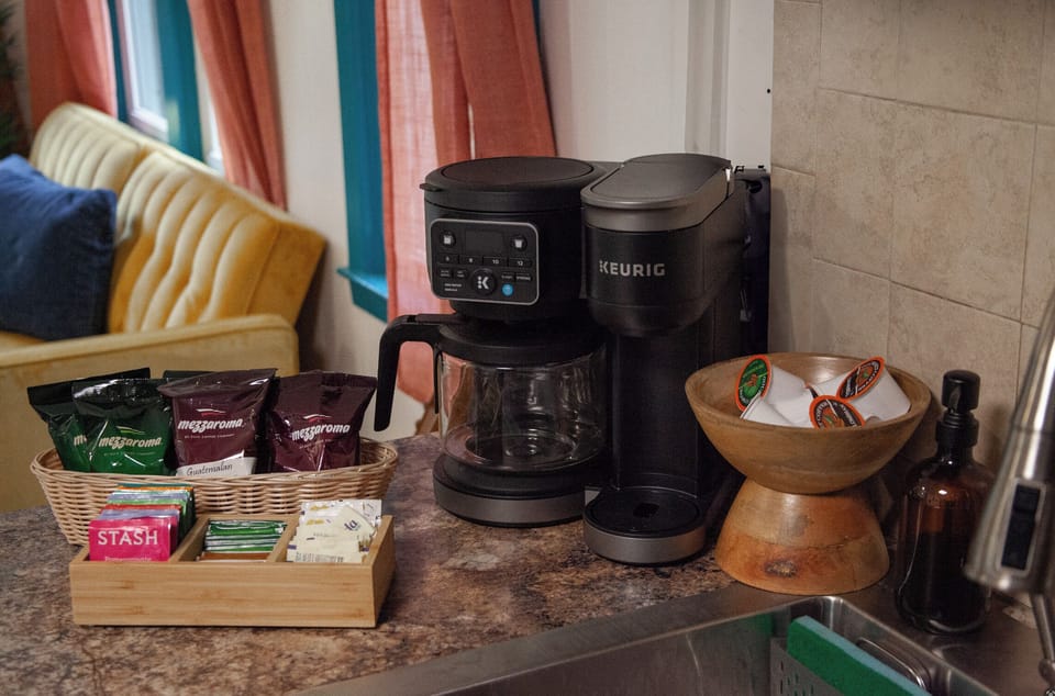 Fresh coffee brews daily in a stylish pot—your perfect morning ritual spot.
