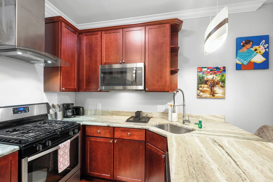 Dining area doubles as versatile workspace—perfect for meals or remote work.