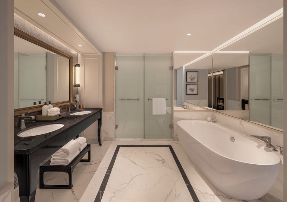 Separate tub and shower, rainfall showerhead, free toiletries