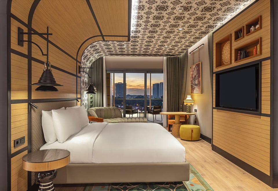 Deluxe Suite, 1 Bedroom, Terrace | Minibar, in-room safe, desk, soundproofing