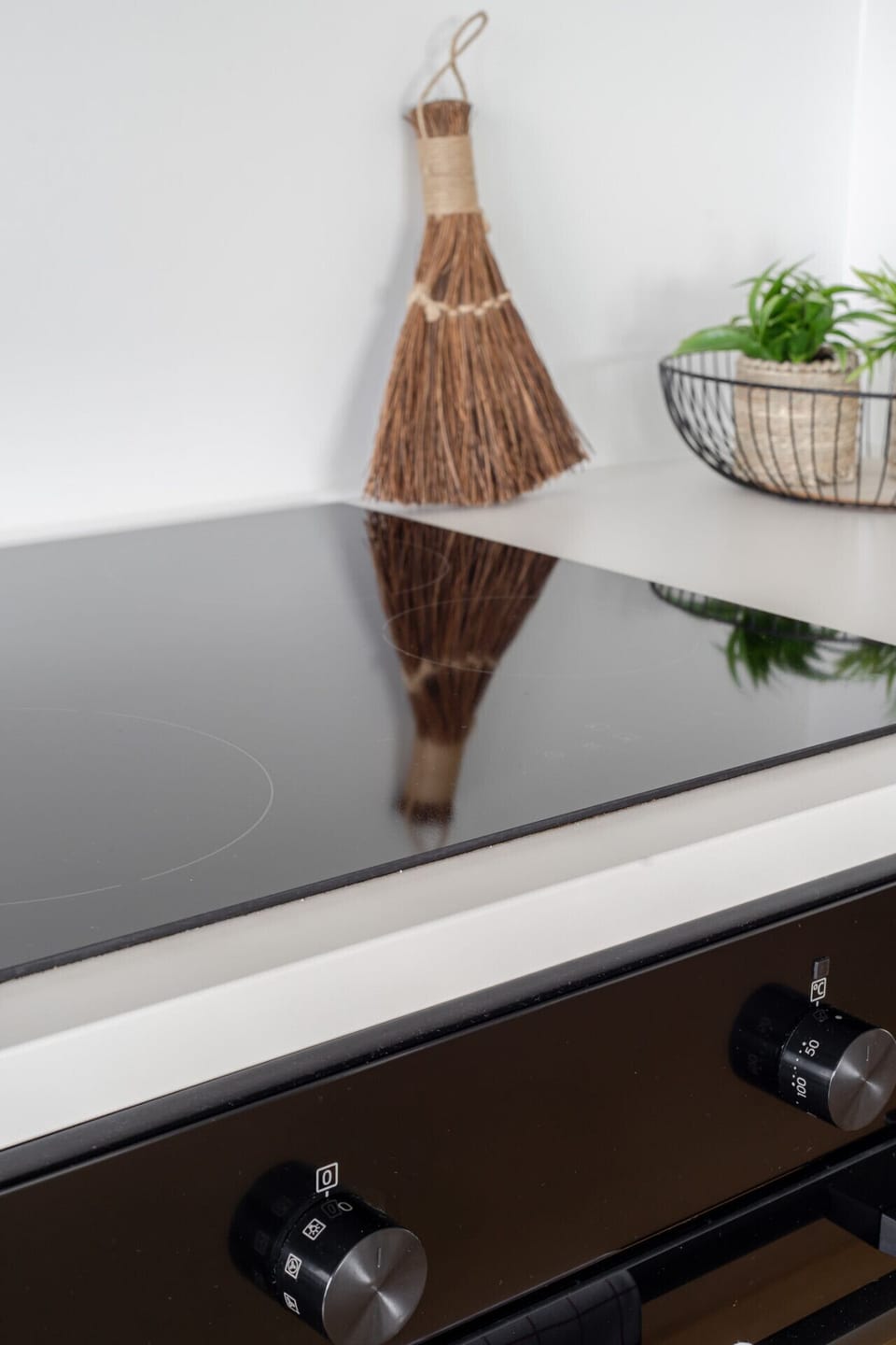 Sleek, fully equipped minimalist kitchen with high-end appliances for a seamless stay.