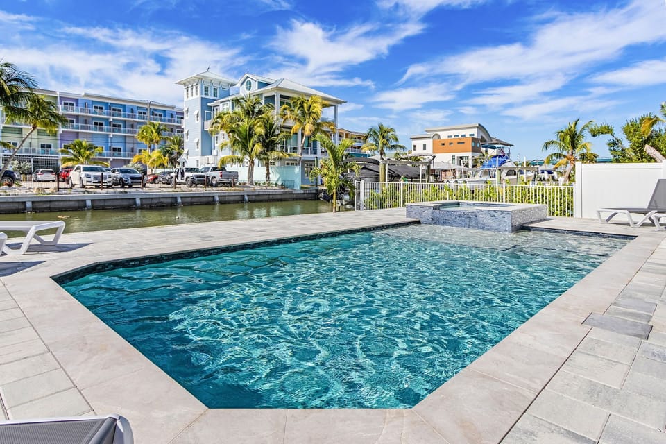 Soak in the private canal-front heated pool and spa