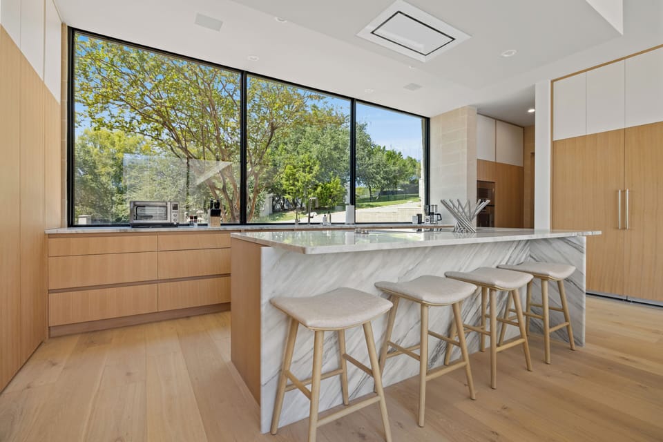 Kitchen area with bar seating for four people for the perfect spot to sip on your morning coffee