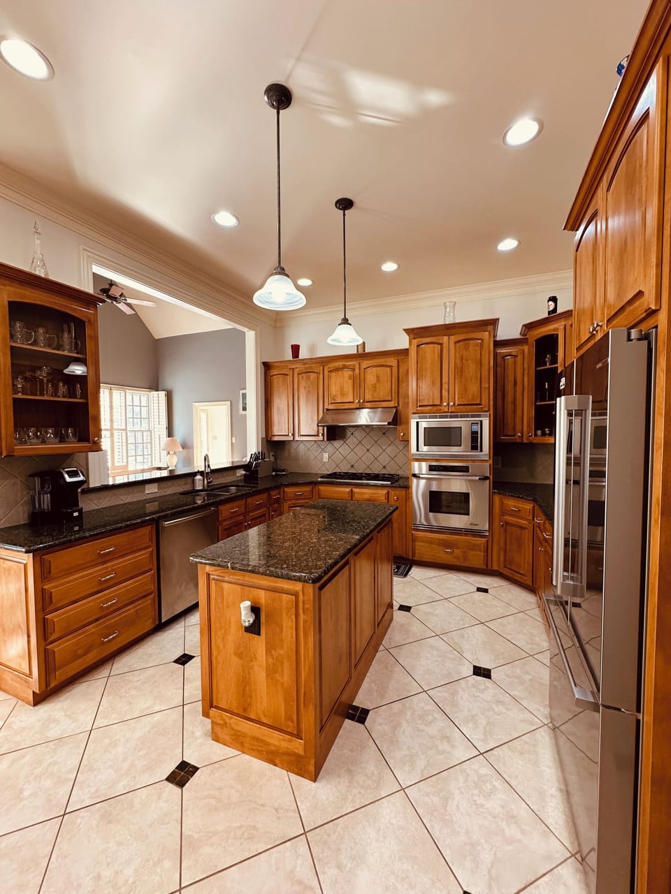 Fully stocked kitchen with premium appliances and granite countertops
