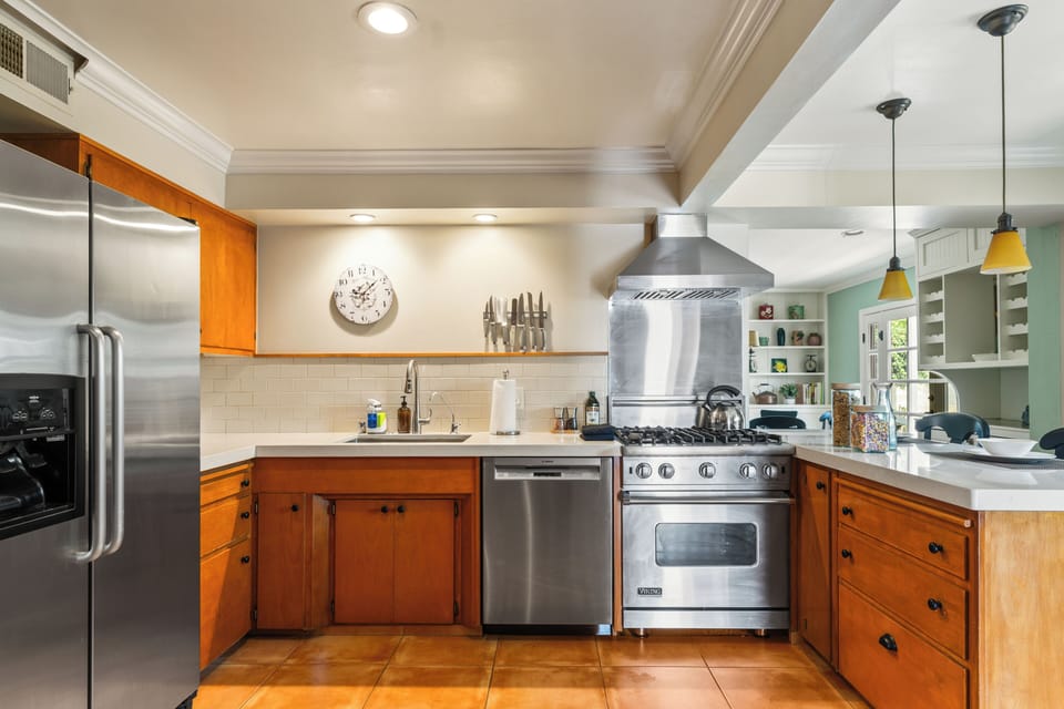 Modern kitchen with stainless steel appliances.
