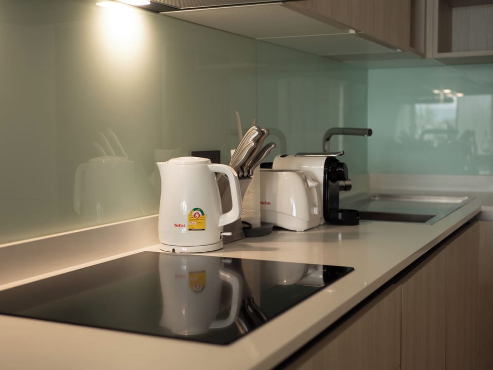 Comfort Apartment | Private kitchen | Espresso maker, electric kettle, highchair