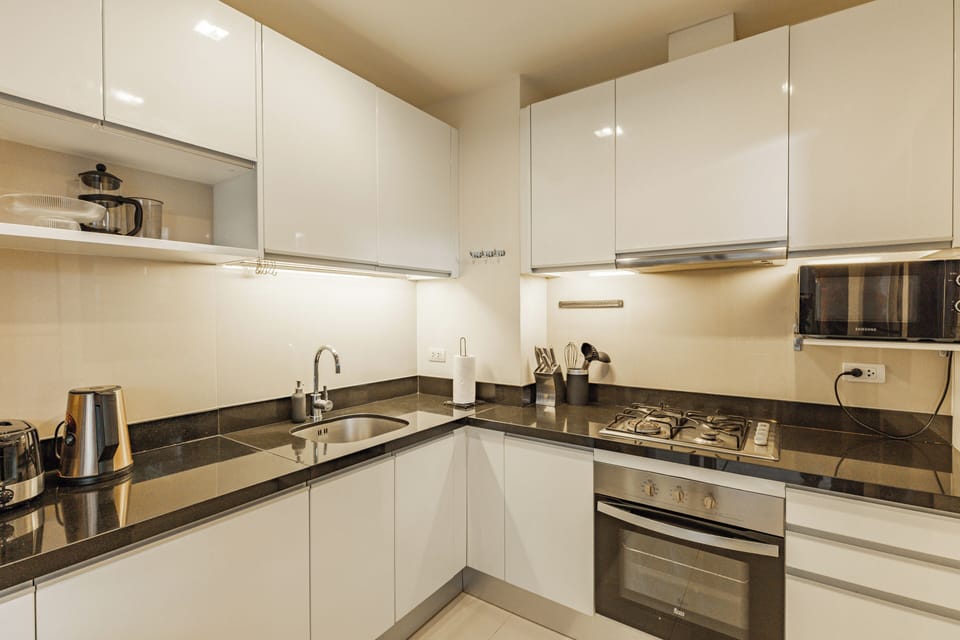 Comfort Townhome, Patio | Private kitchen | Electric kettle, highchair