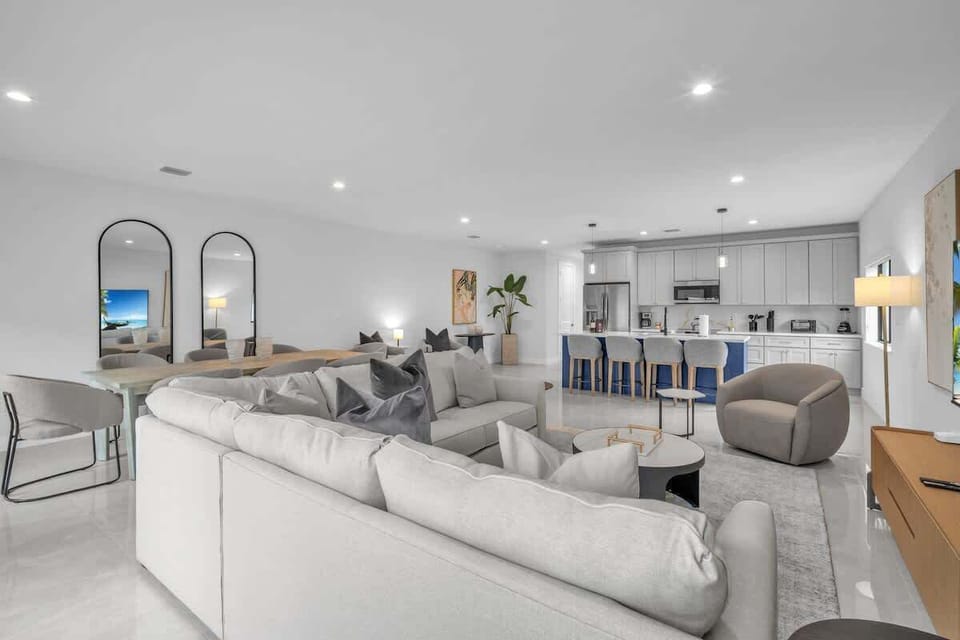 Spacious living room with a sofa bed and widescreen TV for relaxing and entertainment after a day of exploring.