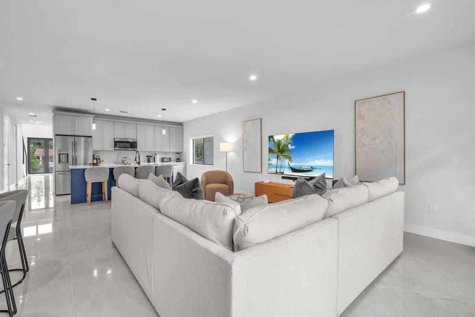 Spacious living room with a sofa bed and widescreen TV for relaxing and entertainment after a day of exploring.