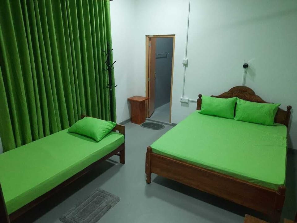 Deluxe Triple Room | Desk, laptop workspace, iron/ironing board