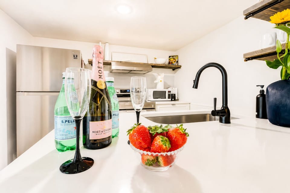 Bright modern kitchen with sleek finishes and a welcome-worthy touch