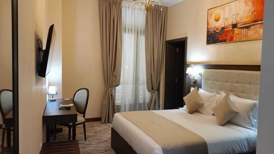 Deluxe Single Room, Balcony, City View | In-room safe, desk, laptop workspace, blackout drapes