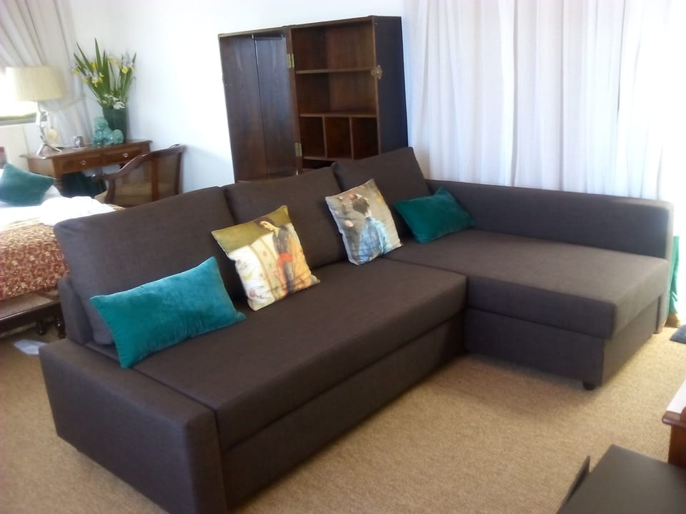 Luxury Quadruple Room, Poolside | Living area | Flat-screen TV