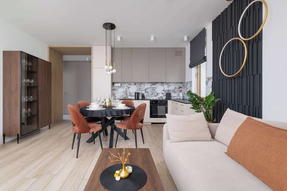 An elegant dining area open to the kitchen makes serving meals easier and encourages togetherness while cooking.