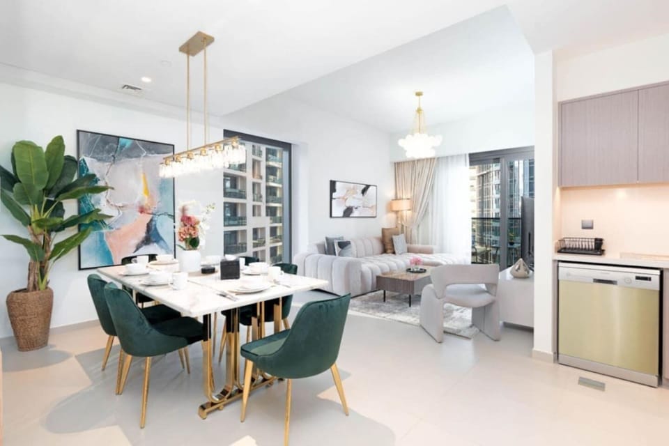 Rectangular marble table supported by striking gold-finished legs dining area!