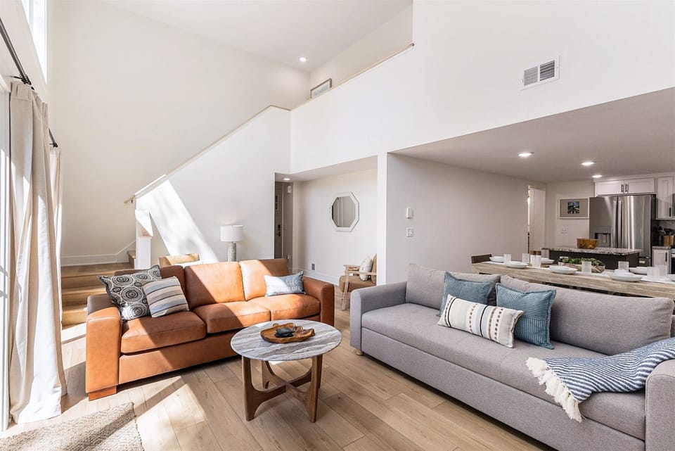 Open floor plan with soaring ceilings.