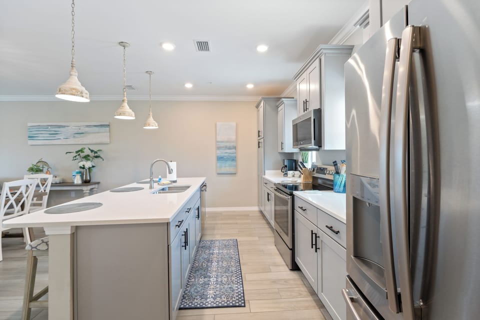Beautiful Moments - 14237 Beach Heather Drive at Lost Key - Modern kitchen is fully equipped with everything to prepare meals and snacks.