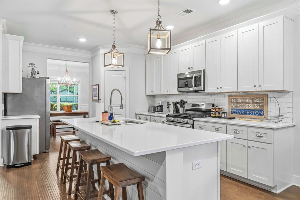 Gather around the countertop bar for morning coffee, evening drinks, or casual meals between adventures.
