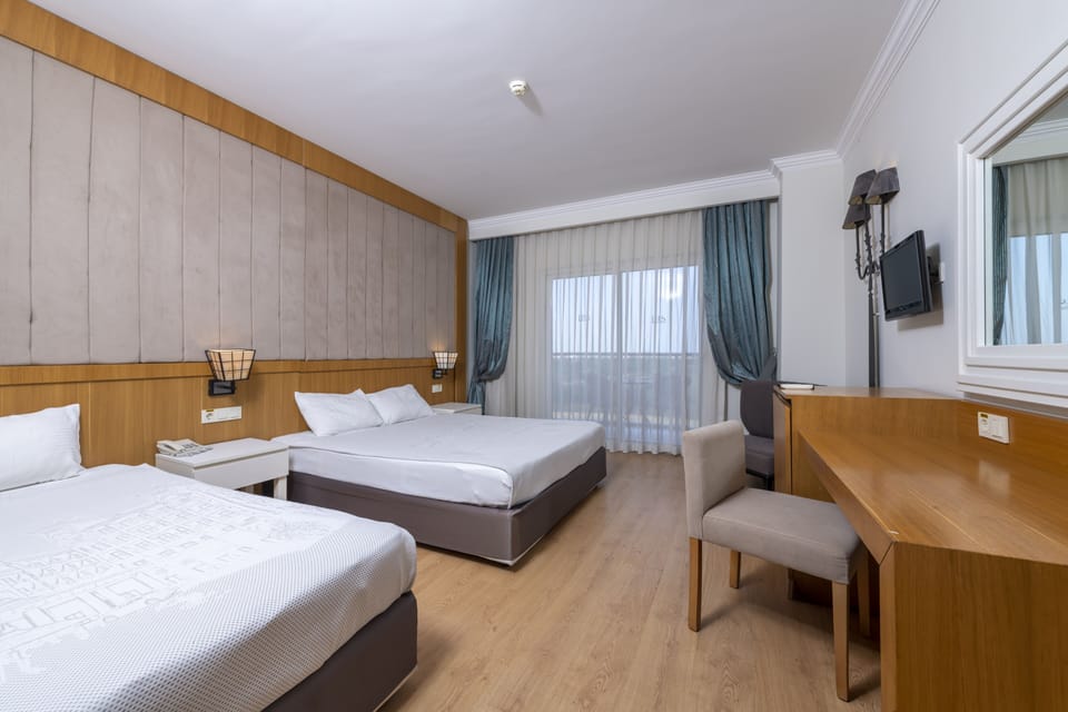 Family Room | Premium bedding, minibar (free items), in-room safe, desk