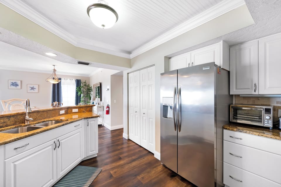 Stainless appliances in the kitchen and a large pantry