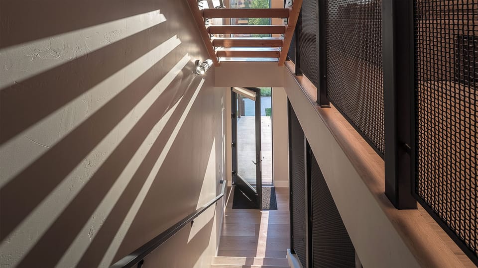 View down the stairway to the street-level entry