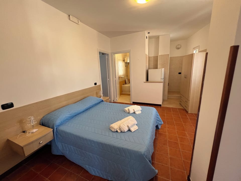Triple Room, Partial Sea View | Desk, blackout drapes, free WiFi