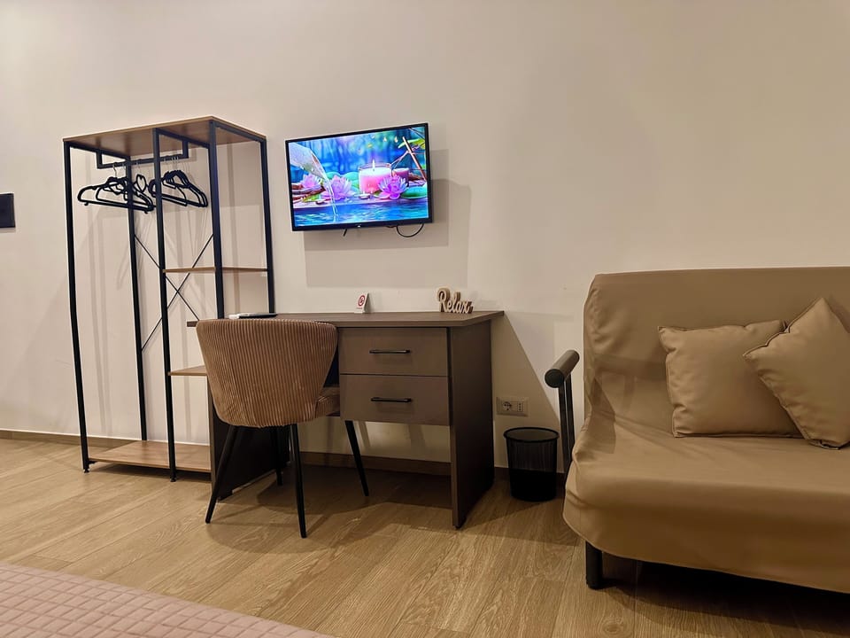 Classic Quadruple Room, City View | Desk, laptop workspace, free WiFi